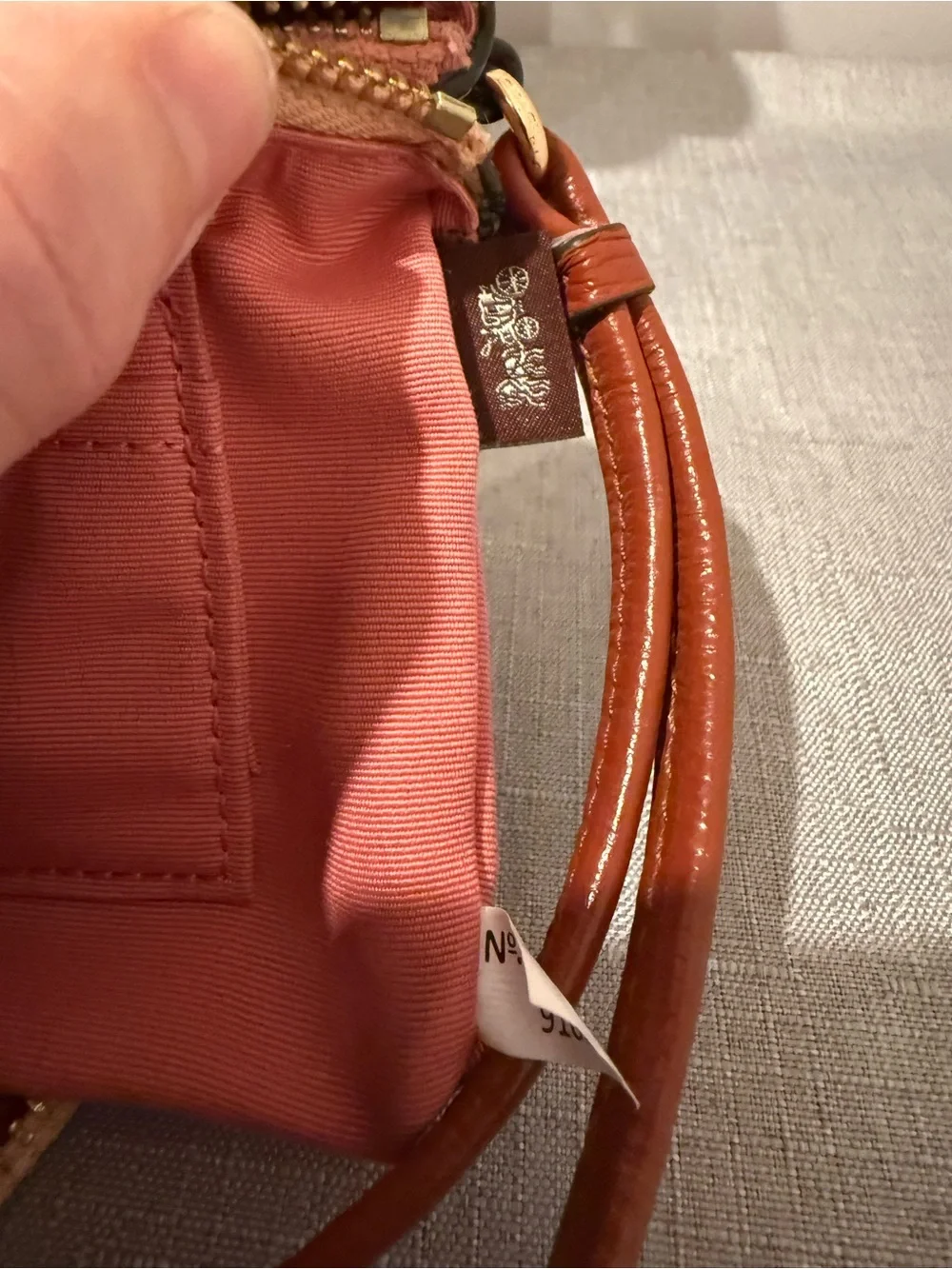 Coach Pink and Peach Two Tone Pebbled Leather Wristlet with Tan Strap